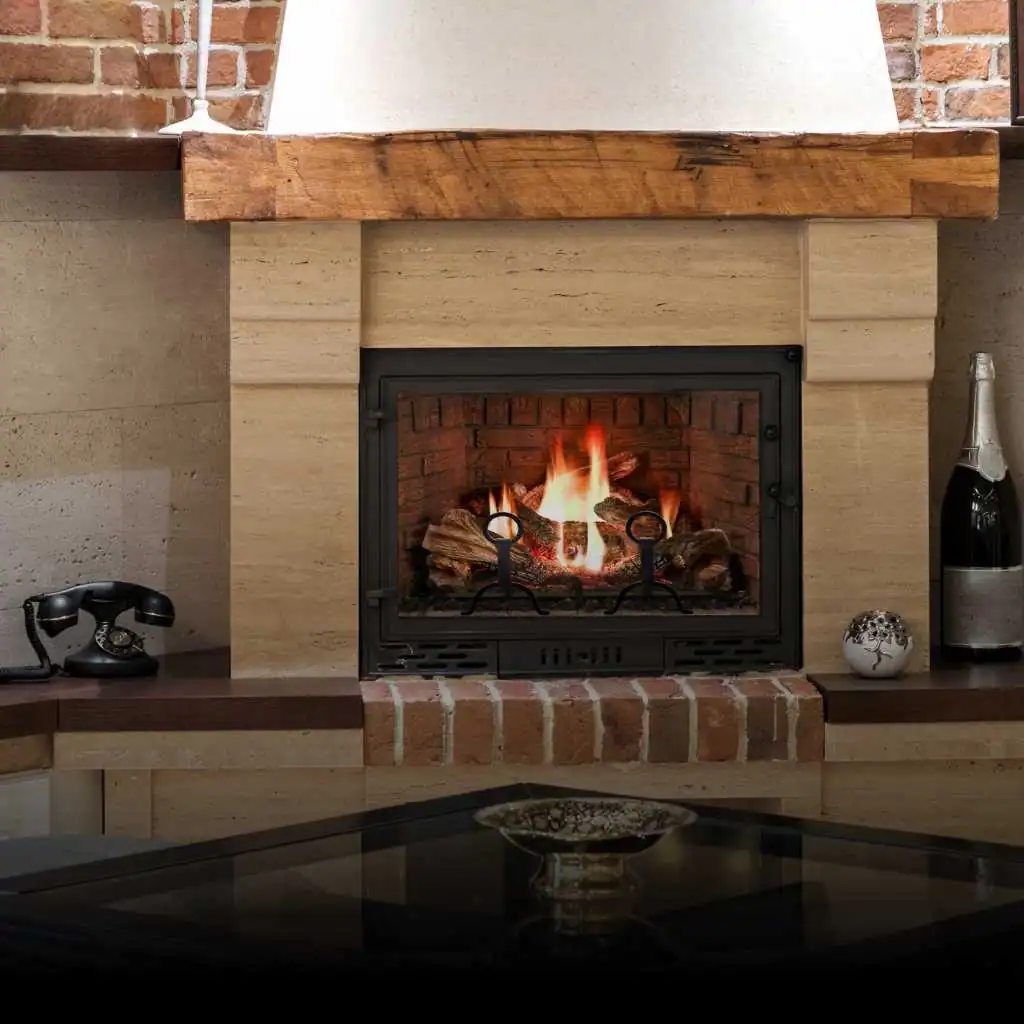 A cozy brick fireplace with a fire burning inside, flanked by a vintage rotary phone on the left and a bottle of champagne on the right&mdash;a setting where even air duct services New Jersey can help keep the ambiance fresh and comfortable.